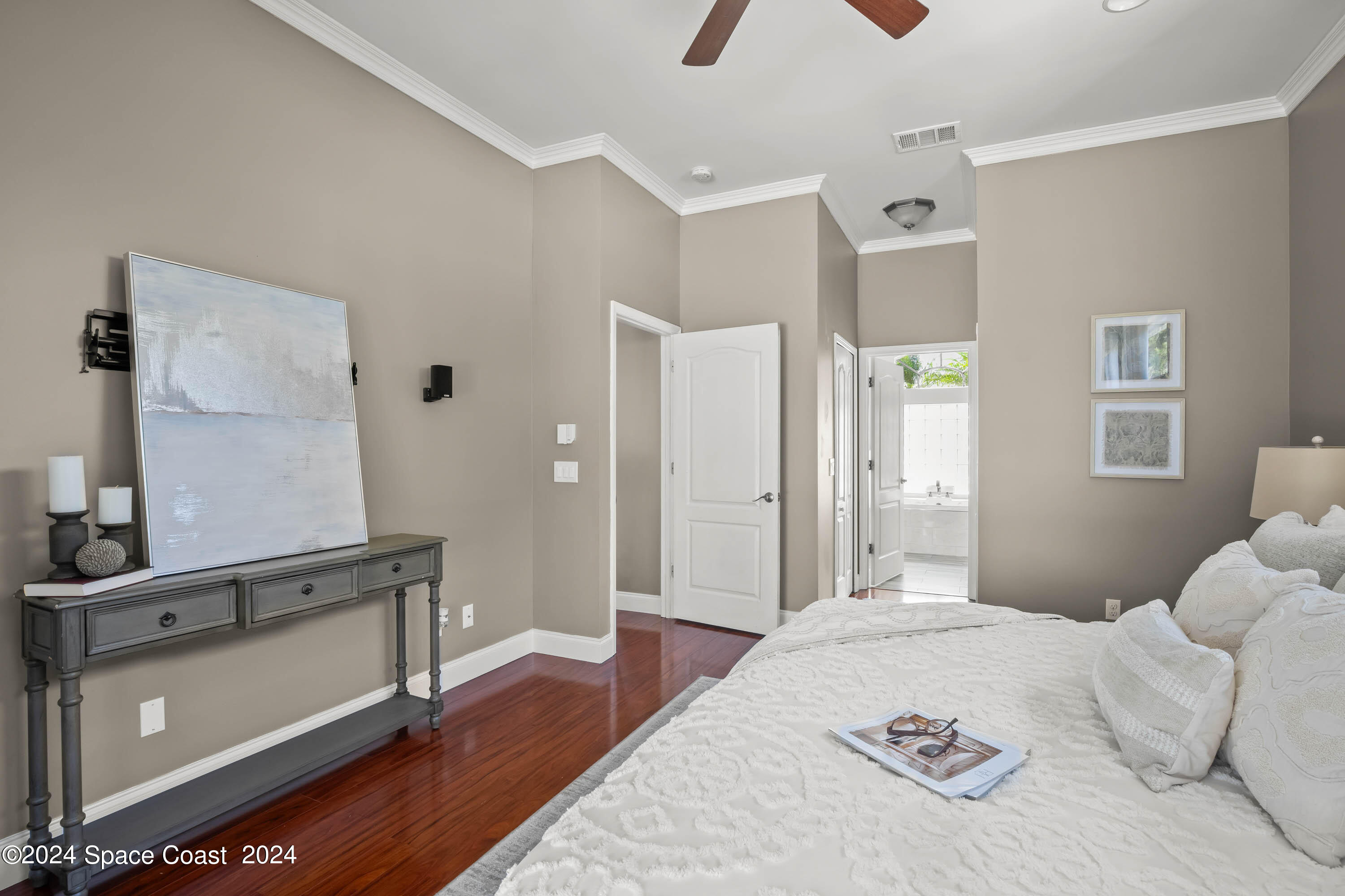 1122 Jan's Place Melbourne, FL 32940 - Photo 16 of 42 a bedroom with a bed and a dresser in it