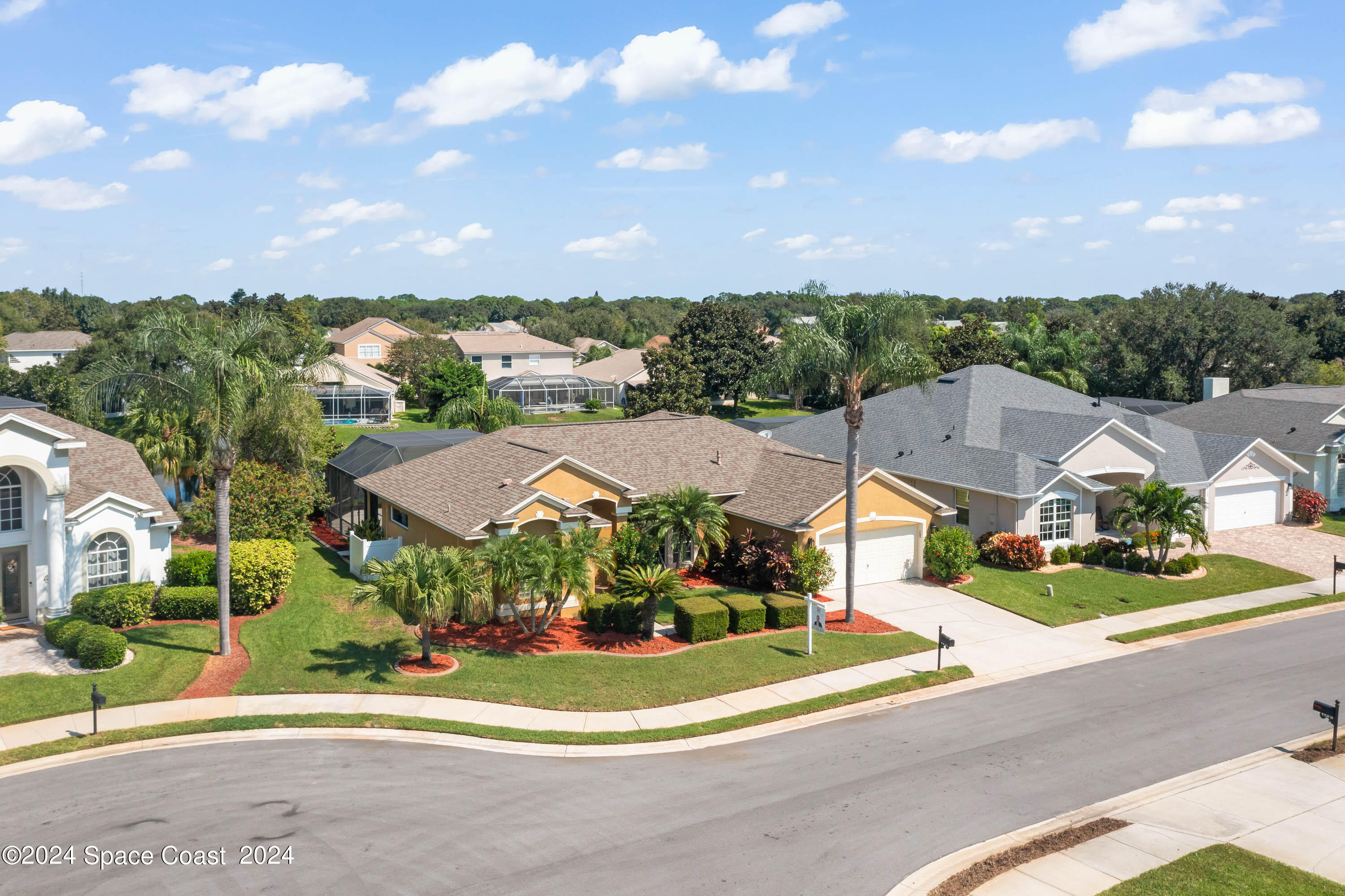 1122 Jan's Place Melbourne, FL 32940 - Photo 2 of 42 a view of a houses with yard and car parked