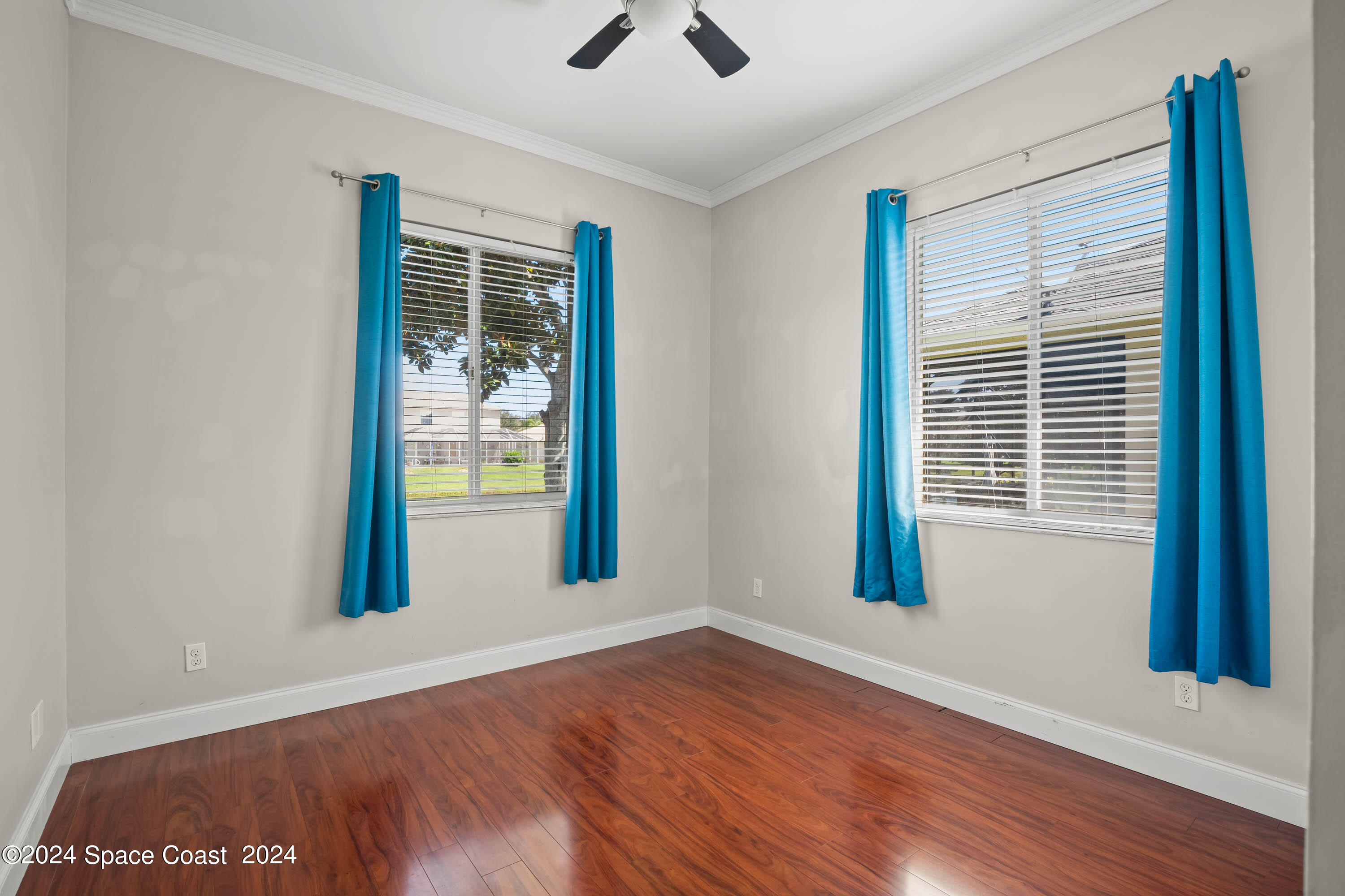 1122 Jan's Place Melbourne, FL 32940 - Photo 22 of 42 a view of an empty room with wooden floor and a window