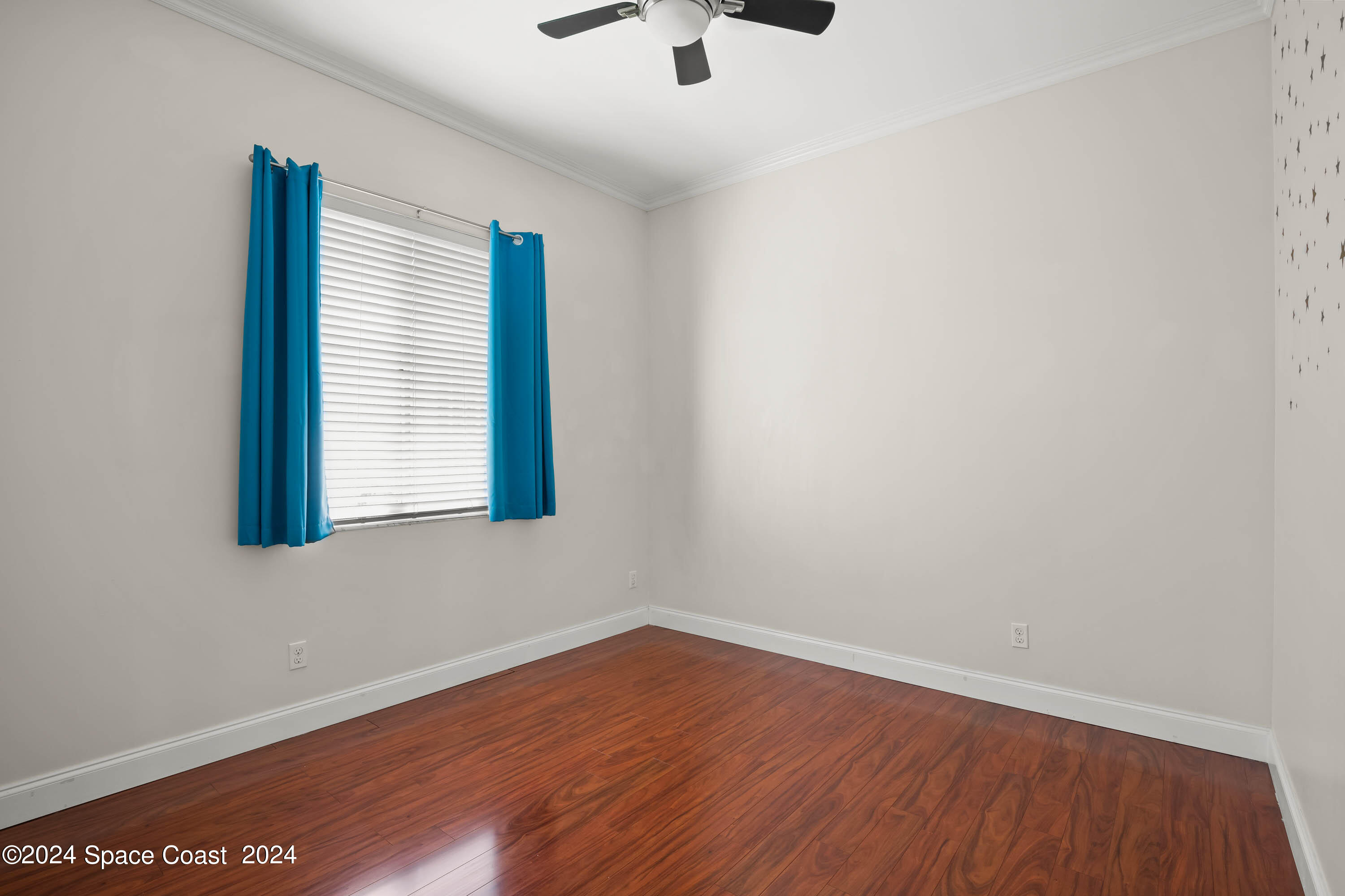 1122 Jan's Place Melbourne, FL 32940 - Photo 23 of 42 an empty room with a window and a ceiling fan