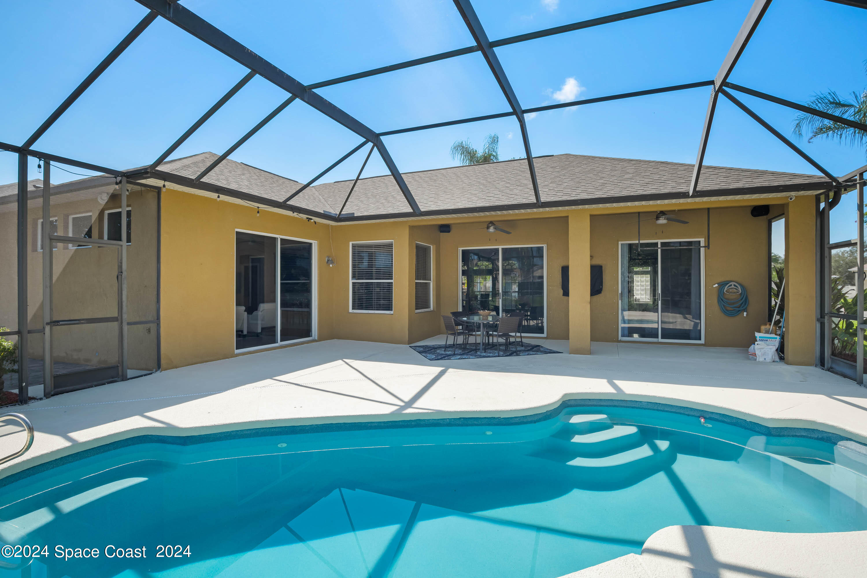 1122 Jan's Place Melbourne, FL 32940 - Photo 28 of 42 a backyard of a house with yard and outdoor seating