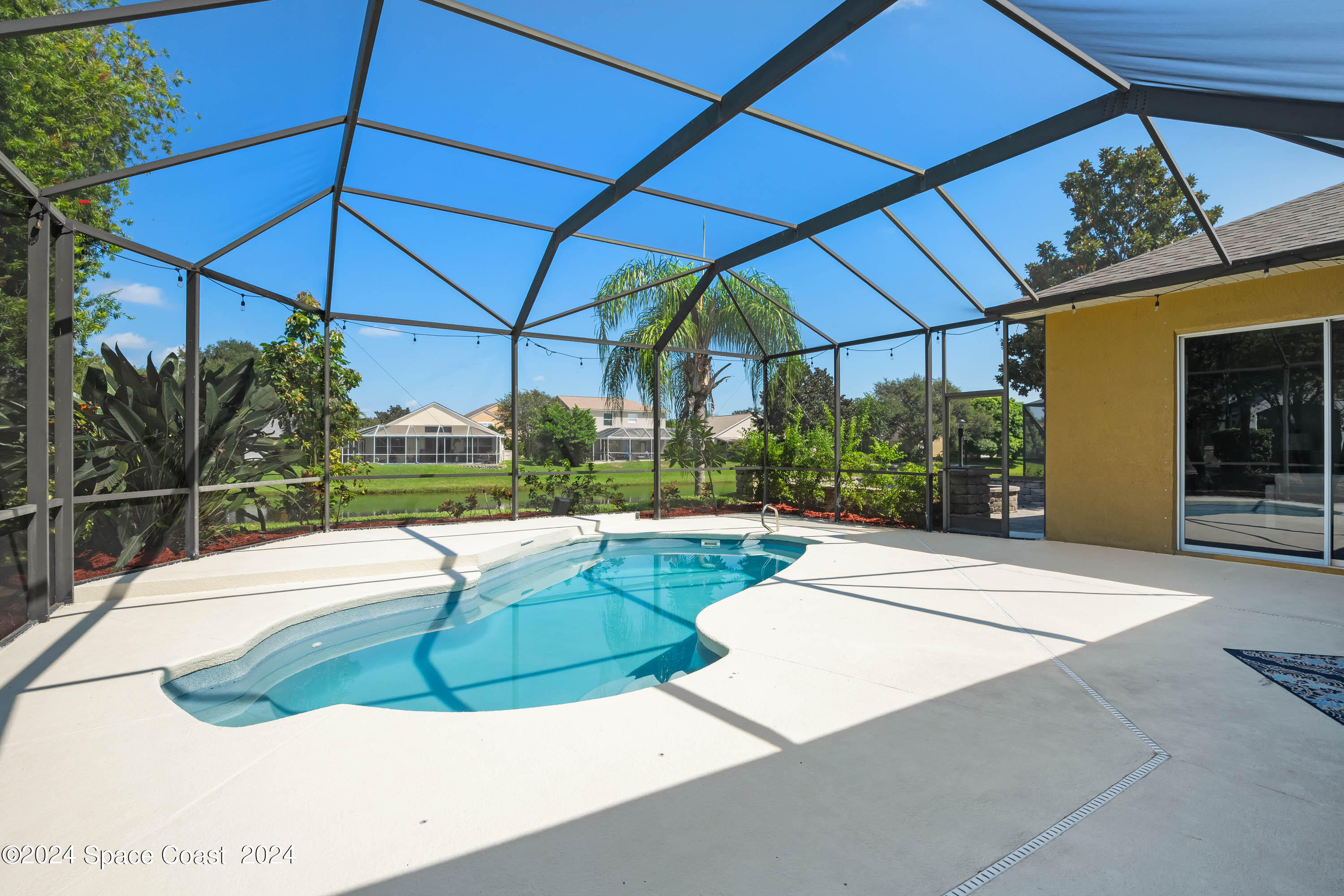 1122 Jan's Place Melbourne, FL 32940 - Photo 29 of 42 a view of a swimming pool with a patio