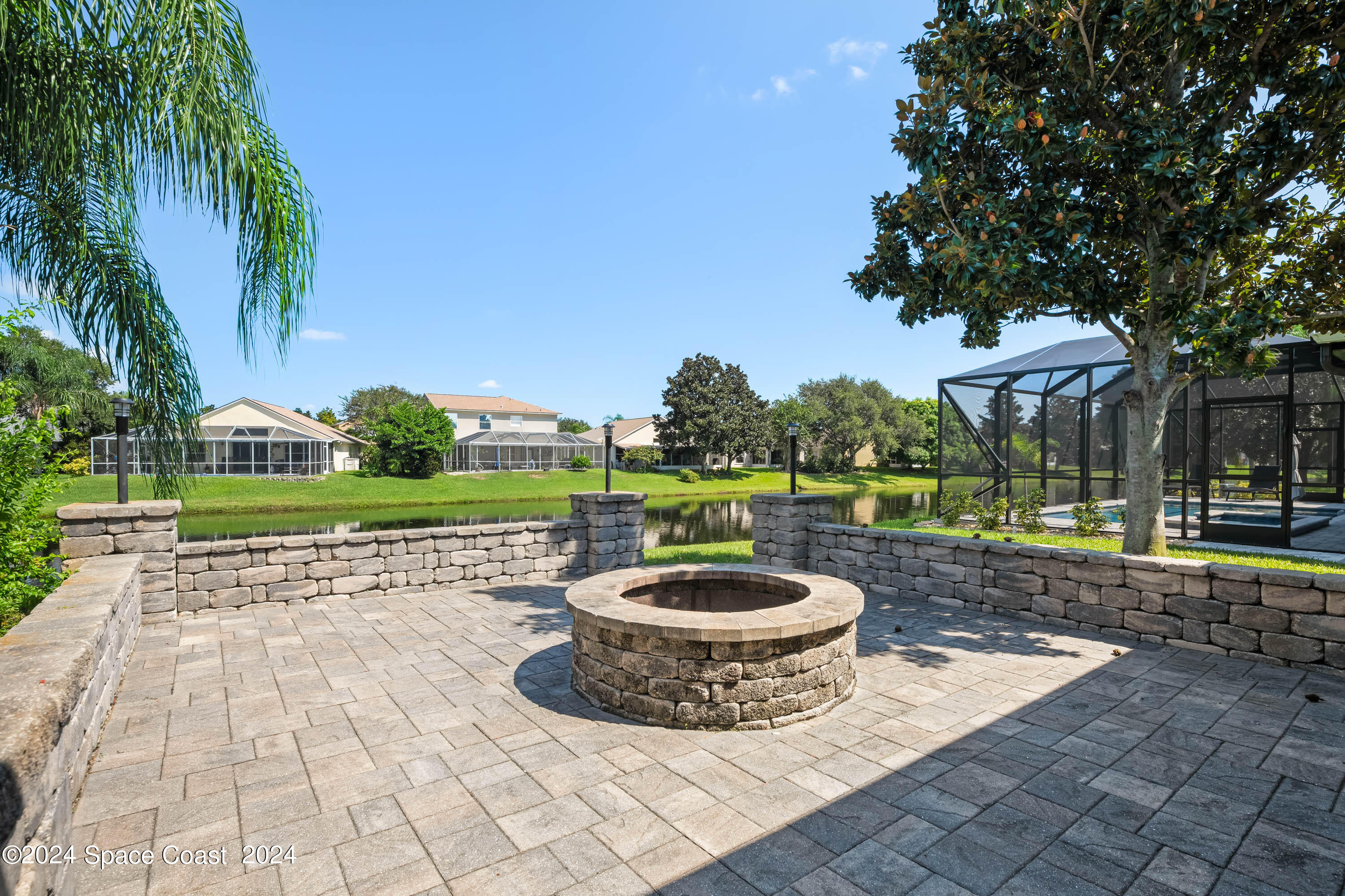 1122 Jan's Place Melbourne, FL 32940 - Photo 30 of 42 a view of a backyard with plants and a patio