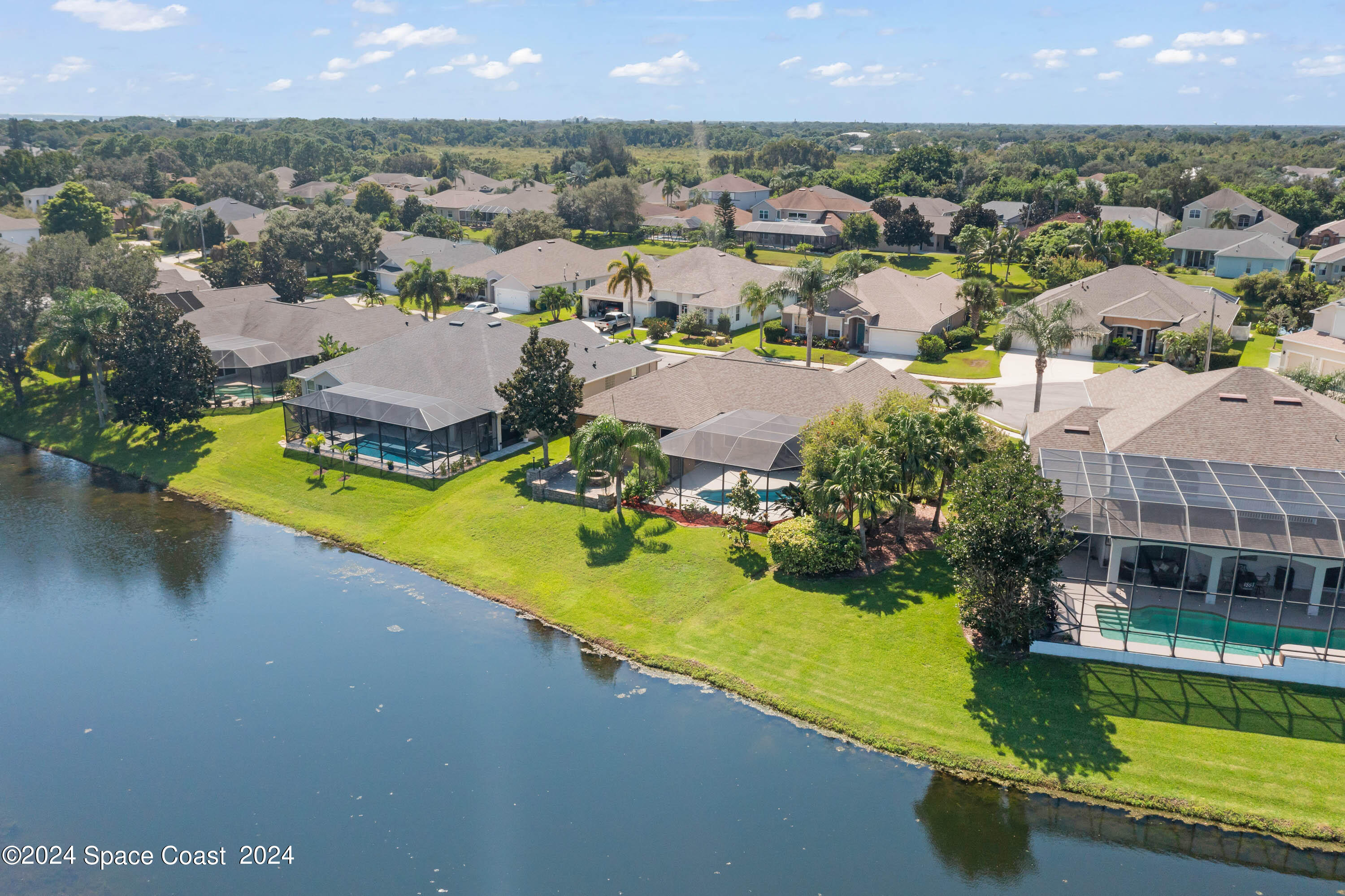1122 Jan's Place Melbourne, FL 32940 - Photo 34 of 42 an aerial view of residential houses with outdoor space and swimming pool