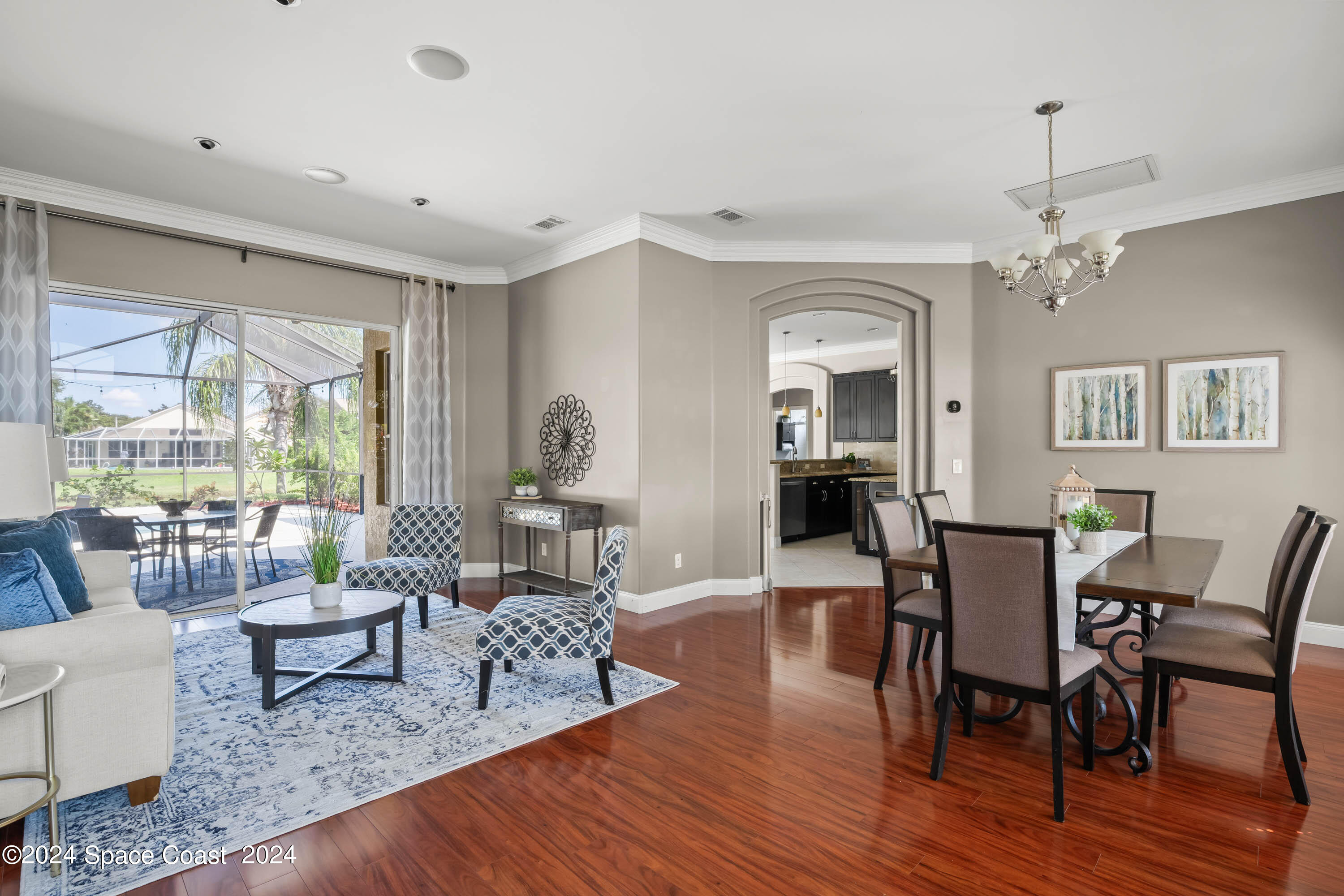 1122 Jan's Place Melbourne, FL 32940 - Photo 4 of 42 a view of a dining room with furniture window and wooden floor