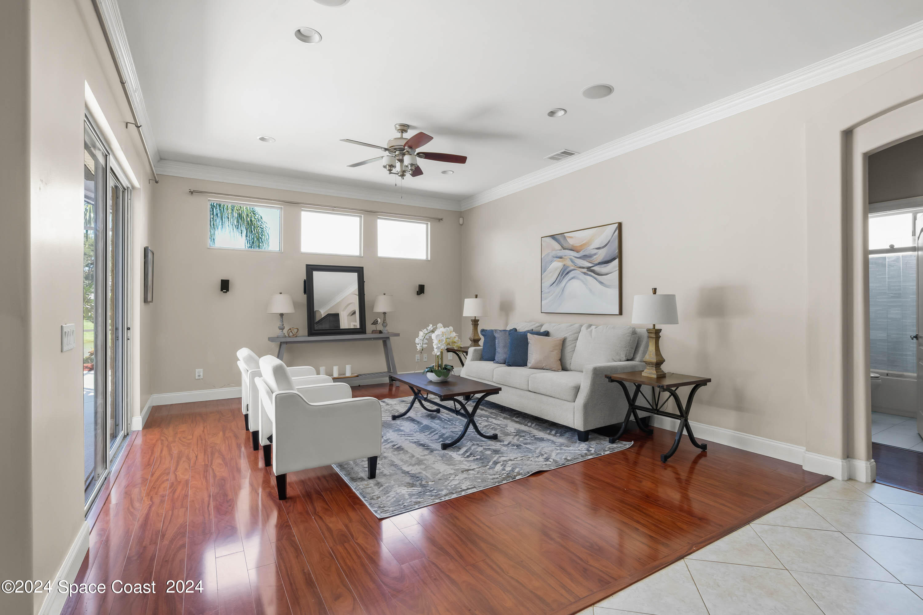 1122 Jan's Place Melbourne, FL 32940 - Photo 8 of 42 a living room with dining room and wooden floor
