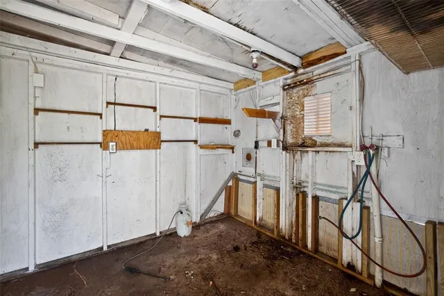 a view of a room with wooden walls