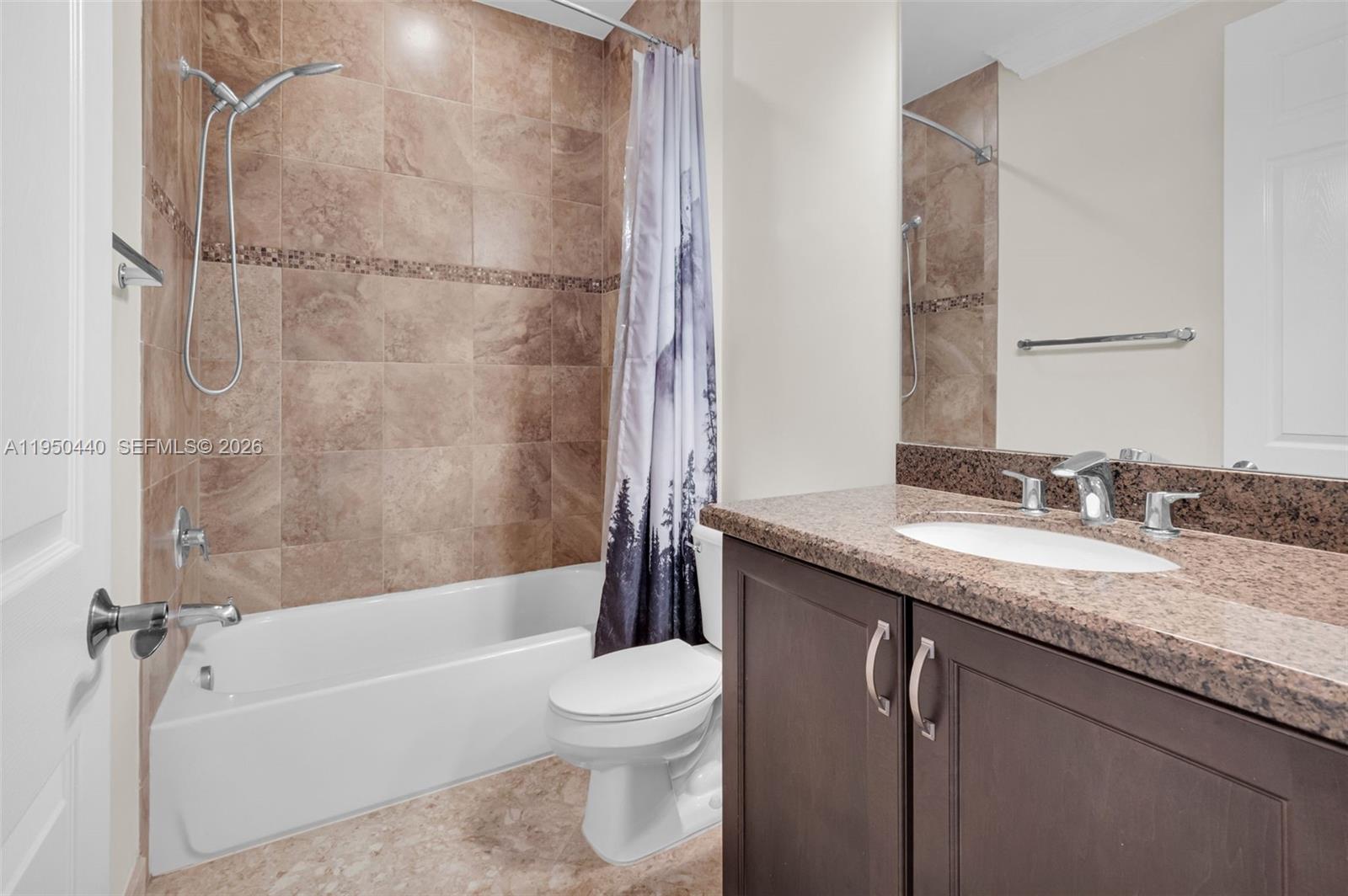 8944 Little Falls Way, Unit 8944 Delray Beach, FL 33446 - Photo 29 of 98 a bathroom with a granite countertop sink toilet and shower