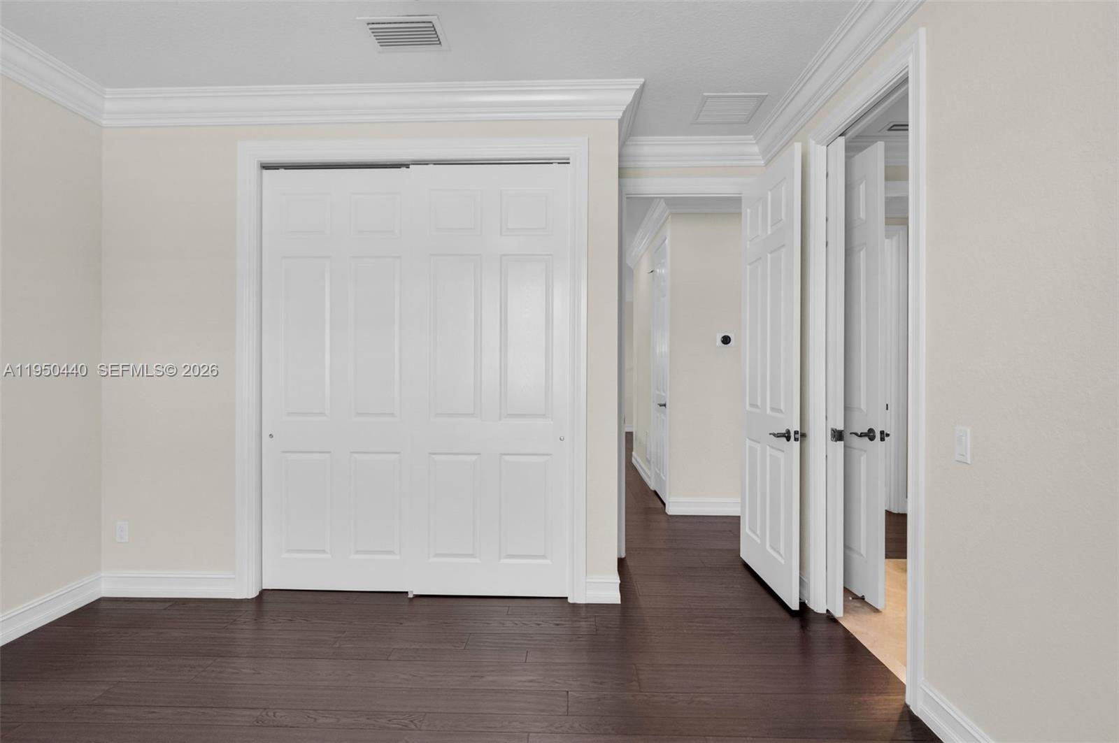8944 Little Falls Way, Unit 8944 Delray Beach, FL 33446 - Photo 35 of 98 a view of an empty room with wooden floor