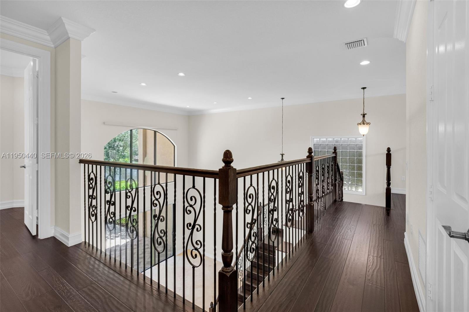 8944 Little Falls Way, Unit 8944 Delray Beach, FL 33446 - Photo 36 of 98 a view of hallway with wooden floor and stairs