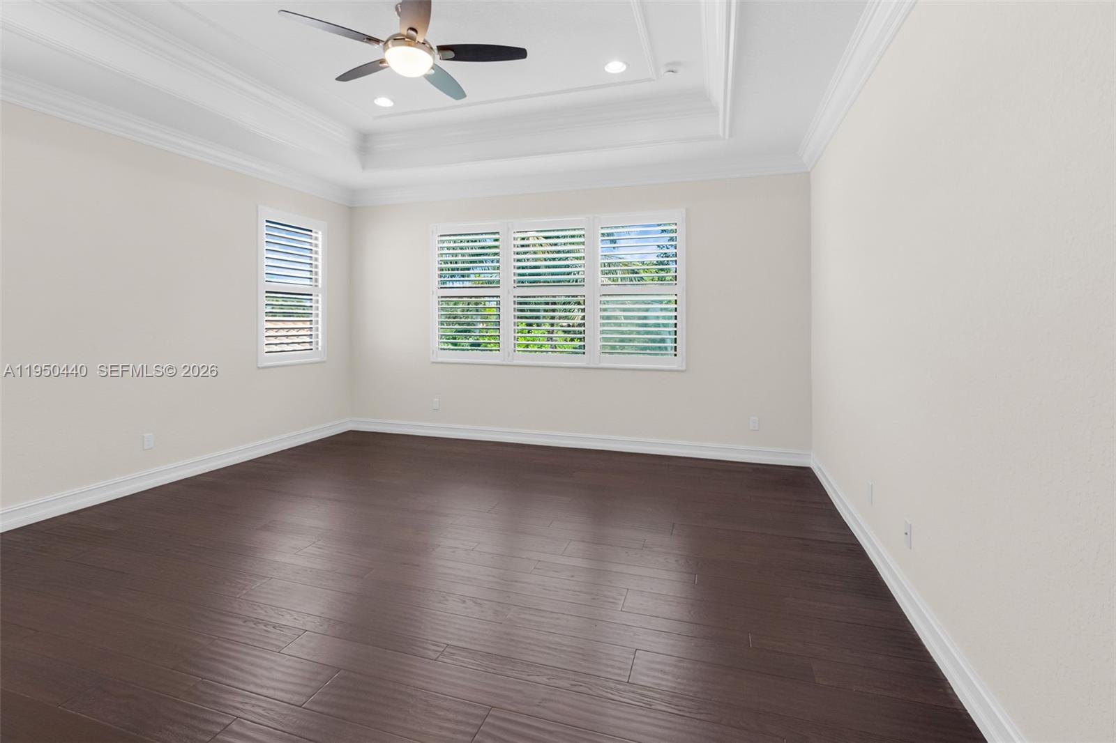 8944 Little Falls Way, Unit 8944 Delray Beach, FL 33446 - Photo 42 of 98 an empty room with wooden floor and windows