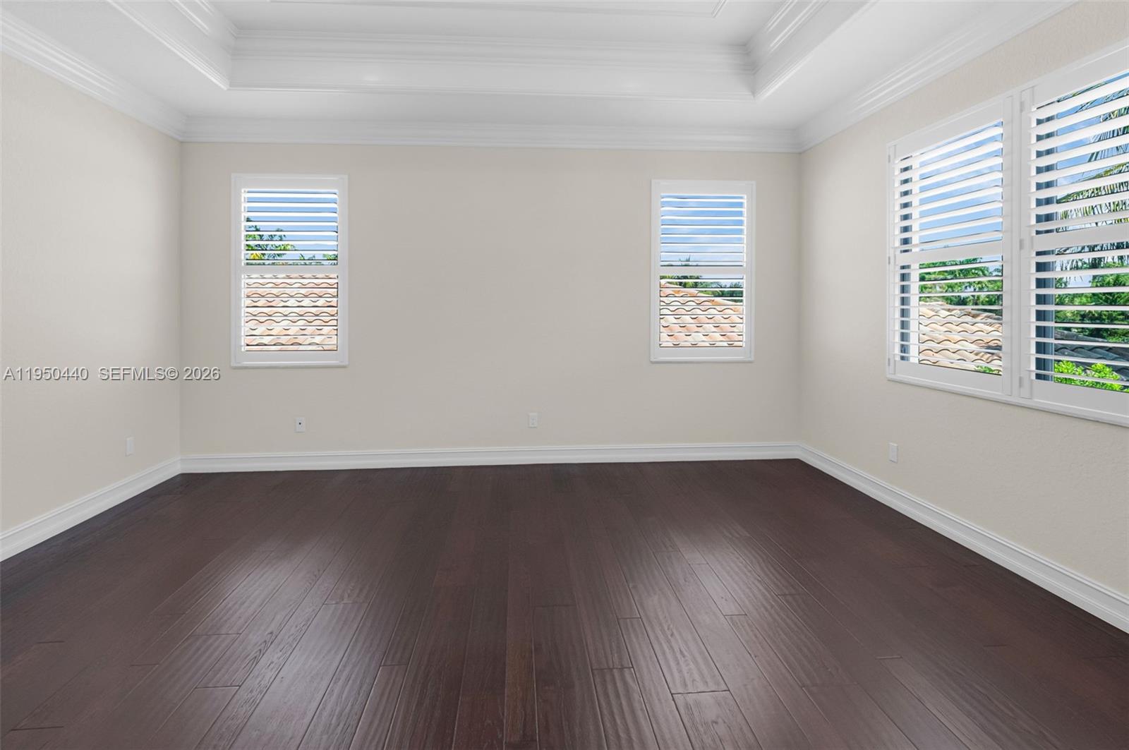 8944 Little Falls Way, Unit 8944 Delray Beach, FL 33446 - Photo 43 of 98 an empty room with wooden floor and windows