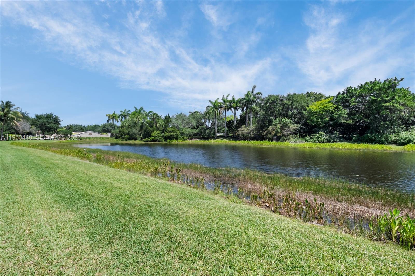 8944 Little Falls Way, Unit 8944 Delray Beach, FL 33446 - Photo 51 of 98 a view of a lake with a big yard