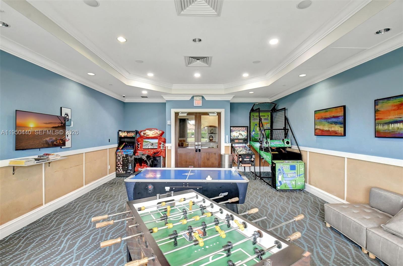 8944 Little Falls Way, Unit 8944 Delray Beach, FL 33446 - Photo 90 of 98 a living room with furniture and a flat screen tv