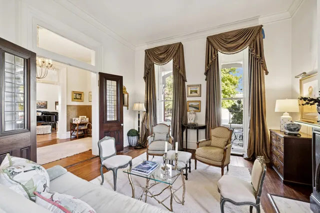 a dining room with furniture and wooden floor