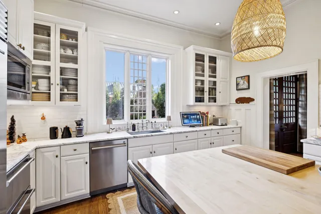 a view of a livingroom with furniture and a dining room