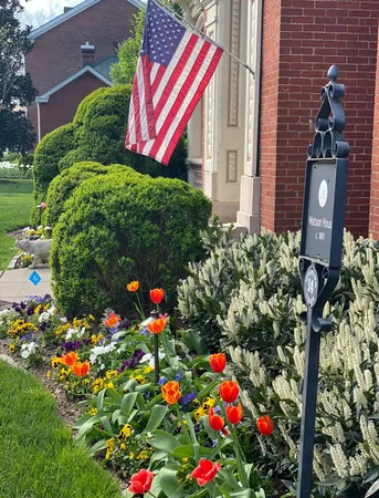a living room with furniture a window and wooden floor