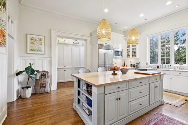 a spacious bedroom with a bed and a couch