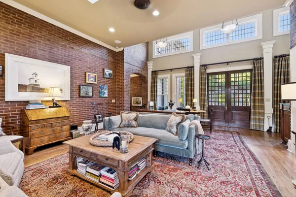 a balcony with furniture and potted plants