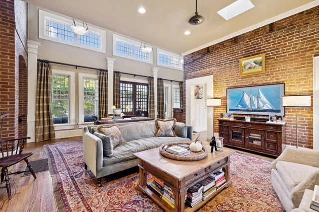 a front view of a house with a pathway and a garage