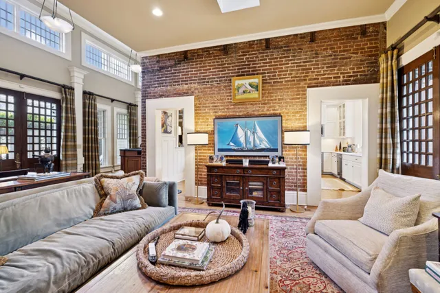 a view of a patio with a table chairs and a backyard