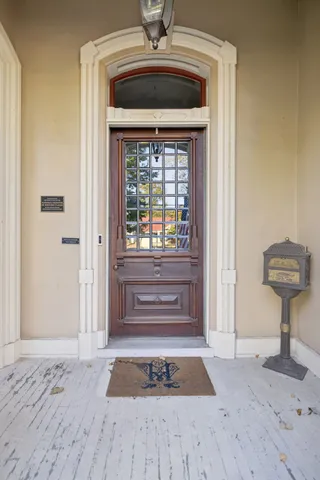 a living room with furniture fireplace and a large window