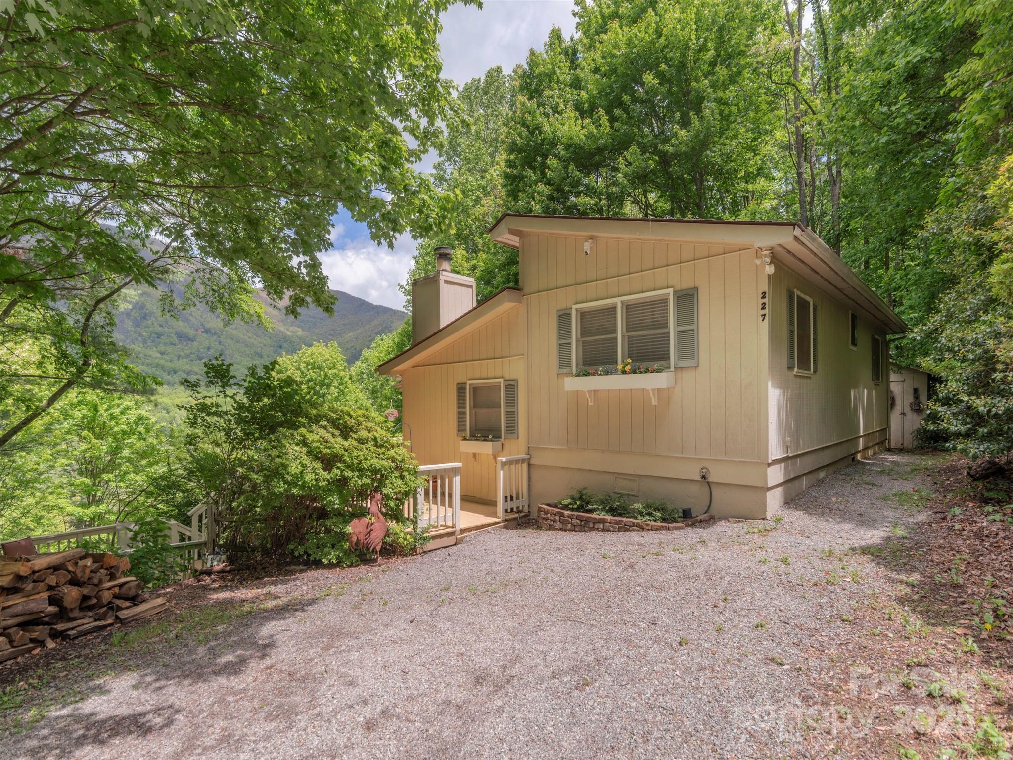227 Soco Acres Road Maggie Valley, NC 28751 - Photo 23 of 27 a view of a house with a yard