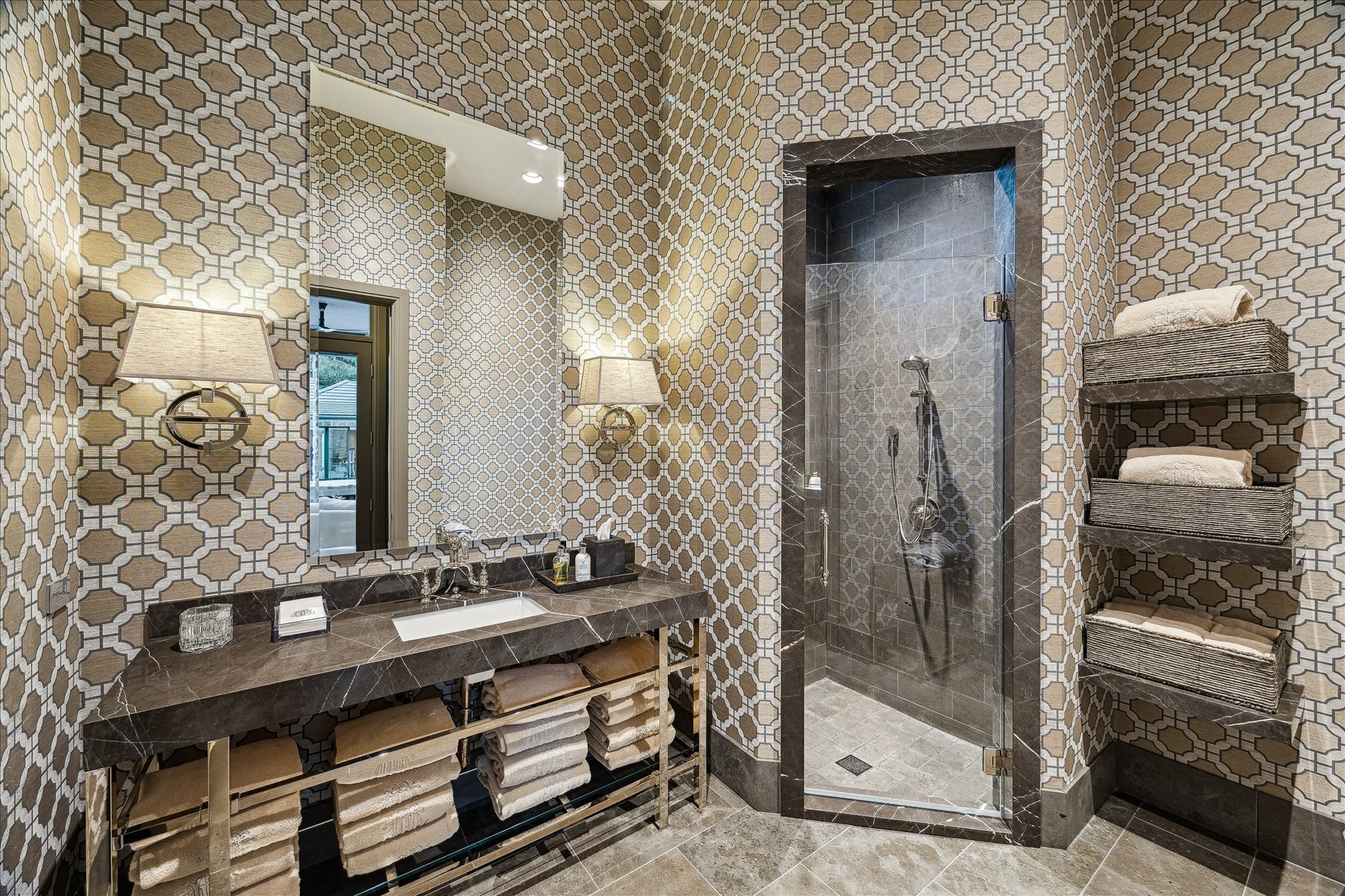 220 Merrie Way Lane Houston, TX 77024 - Photo 20 of 50 This full pool bathroom pairs designer wallpaper with a streamlined walk-in shower and refined finishes.