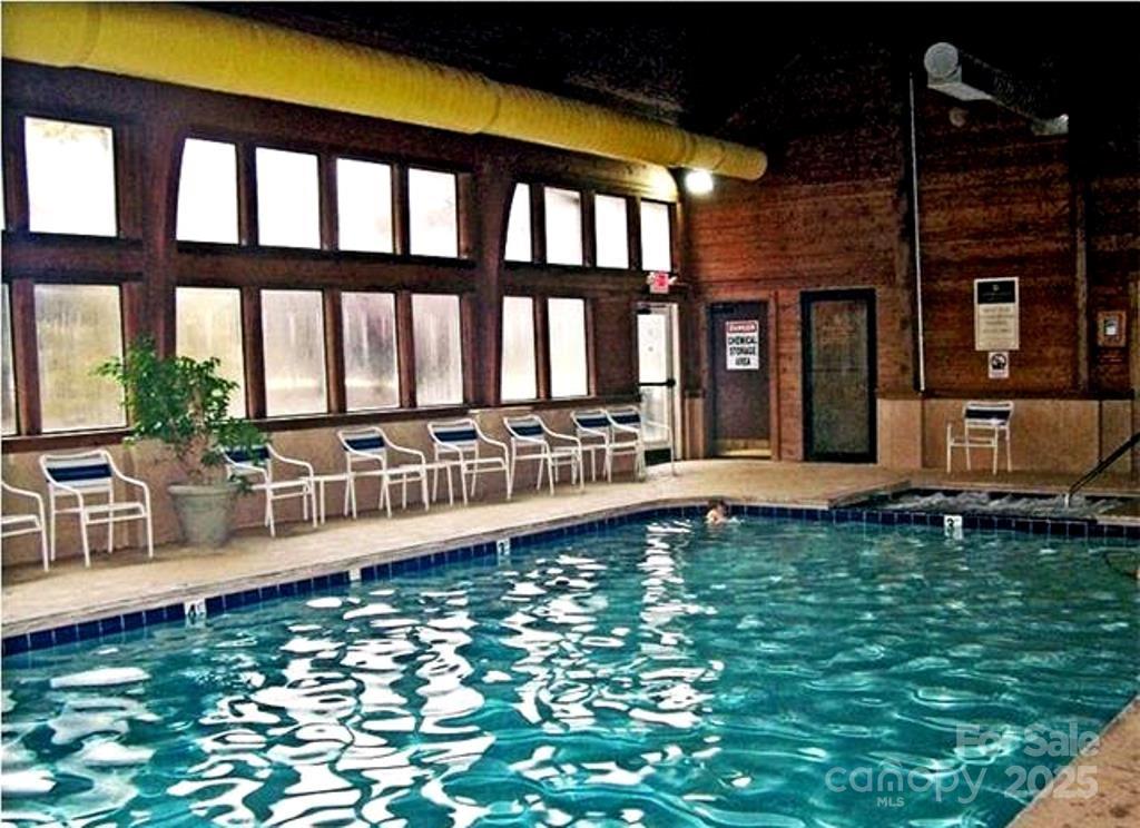 31 High Rock Ridge, Unit 31 Lake Lure, NC 28746 - Photo 22 of 41 a view of a house with swimming pool and sitting area