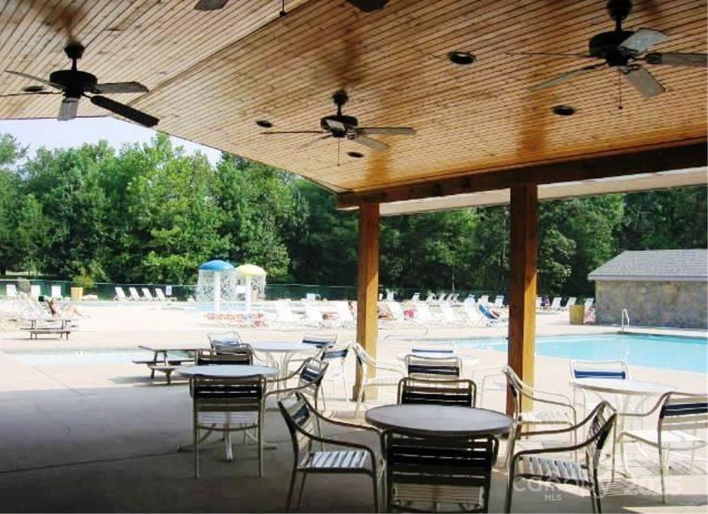 31 High Rock Ridge, Unit 31 Lake Lure, NC 28746 - Photo 24 of 41 a view of a patio with a table chairs and a patio