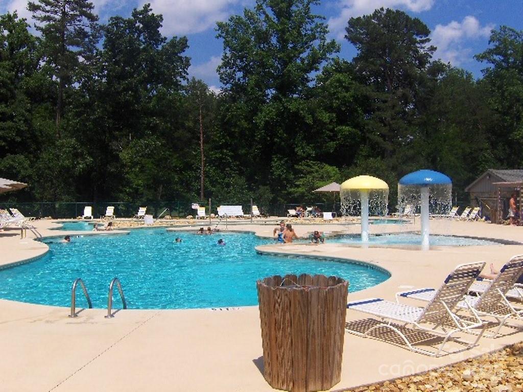 31 High Rock Ridge, Unit 31 Lake Lure, NC 28746 - Photo 25 of 41 a view of a swimming pool and lounge chairs