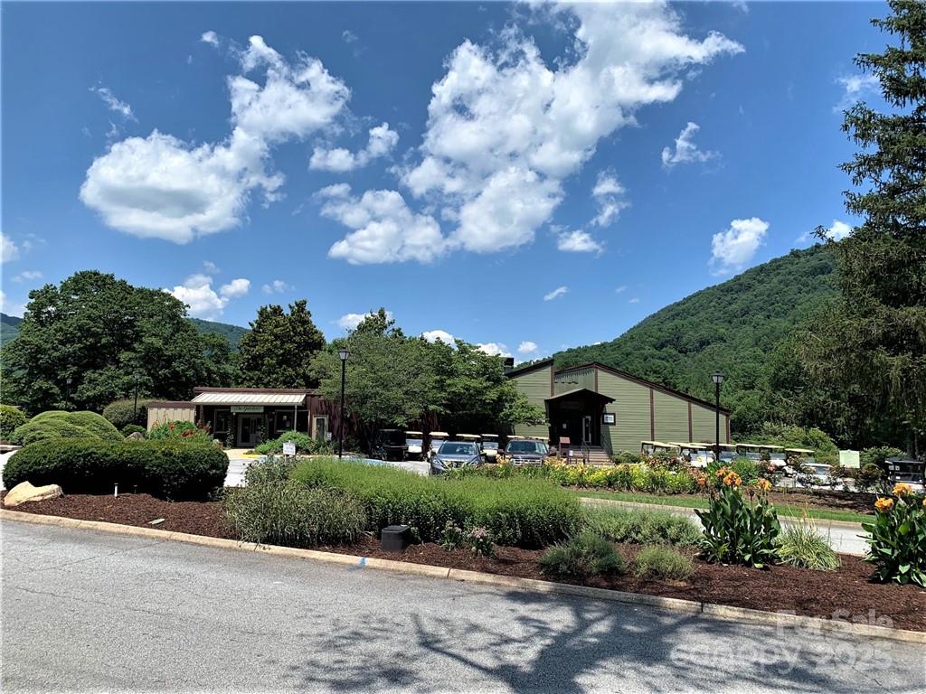 31 High Rock Ridge, Unit 31 Lake Lure, NC 28746 - Photo 34 of 41 a front view of a house with garden