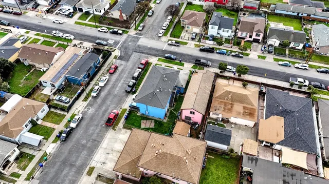an aerial view of residential houses with outdoor space