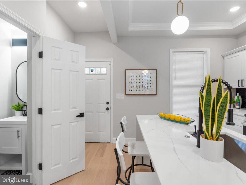 1645 Normal Avenue Baltimore, MD 21213 - Photo 19 of 53 a view of a bedroom with a table and chairs