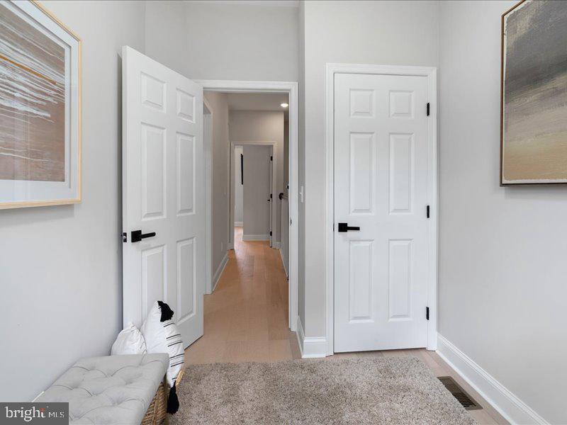 1645 Normal Avenue Baltimore, MD 21213 - Photo 38 of 53 wooden floor with white walls