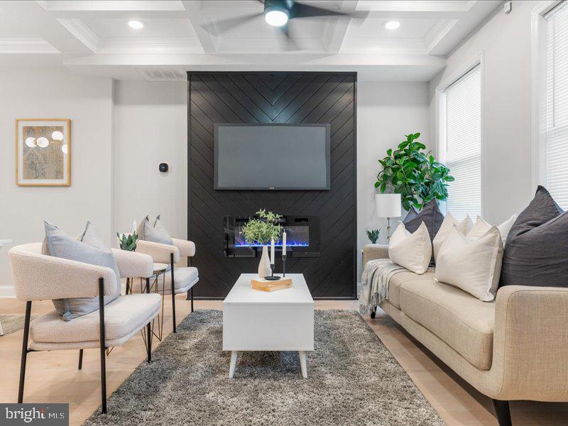 1645 Normal Avenue Baltimore, MD 21213 - Photo 4 of 53 a living room with furniture and a potted plant