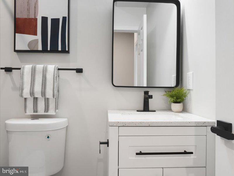 1645 Normal Avenue Baltimore, MD 21213 - Photo 41 of 53 a bathroom with a sink and a mirror