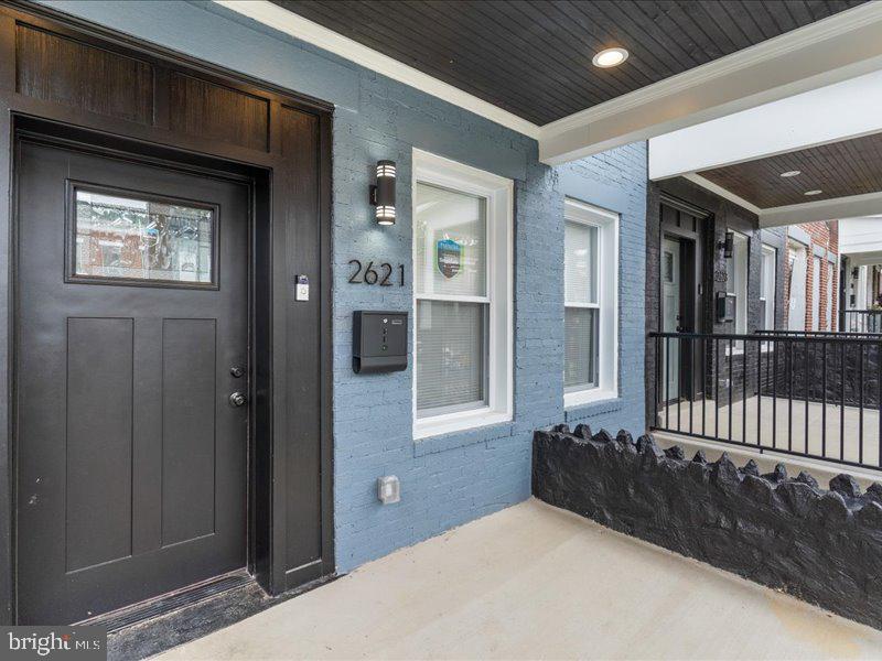 1645 Normal Avenue Baltimore, MD 21213 - Photo 47 of 53 a bedroom with a bed and a window