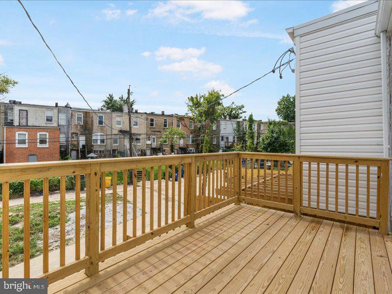 1645 Normal Avenue Baltimore, MD 21213 - Photo 49 of 53 a view of a balcony with wooden floor