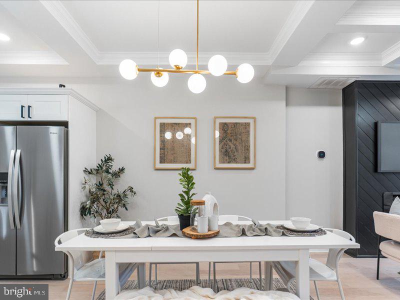 1645 Normal Avenue Baltimore, MD 21213 - Photo 10 of 53 a view of a dining room with furniture and chandelier