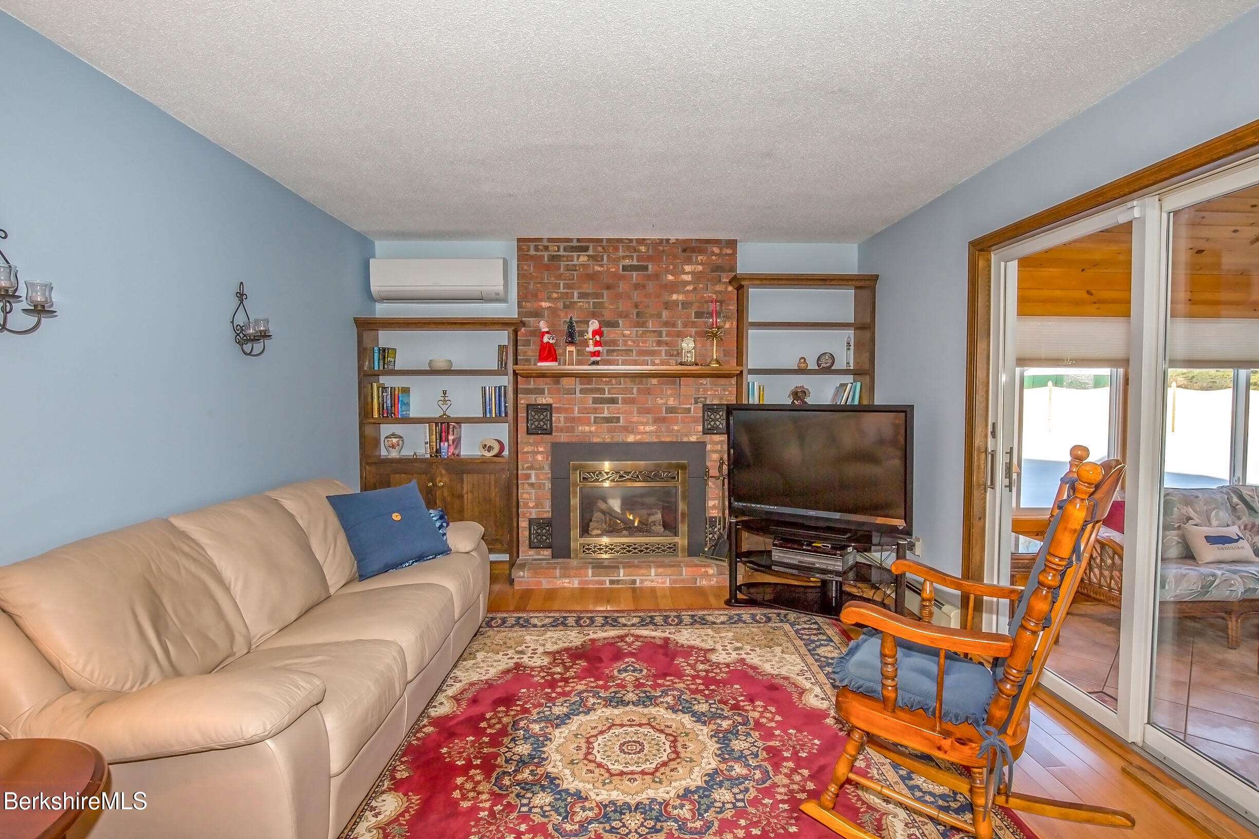 71 King William Road Lenox, MA 01240 - Photo 12 of 43 a living room with furniture and a flat screen tv