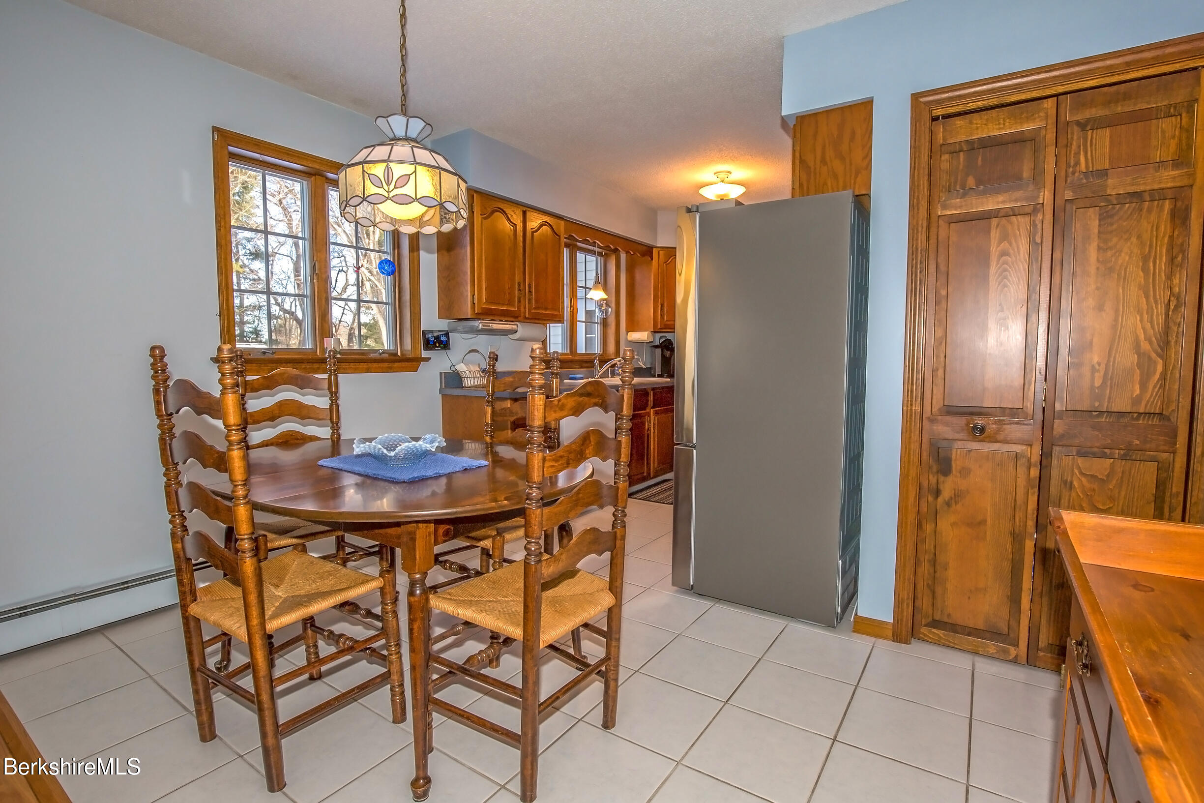 71 King William Road Lenox, MA 01240 - Photo 13 of 43 a view of a dining room with furniture and window