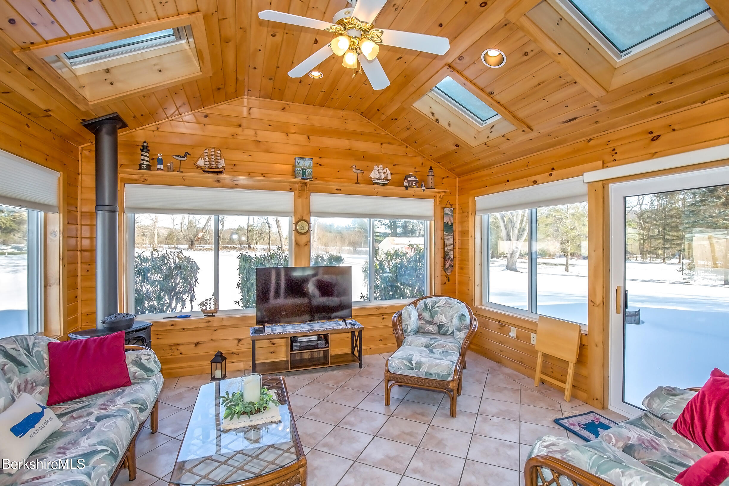 71 King William Road Lenox, MA 01240 - Photo 16 of 43 a living room with furniture and a floor to ceiling window