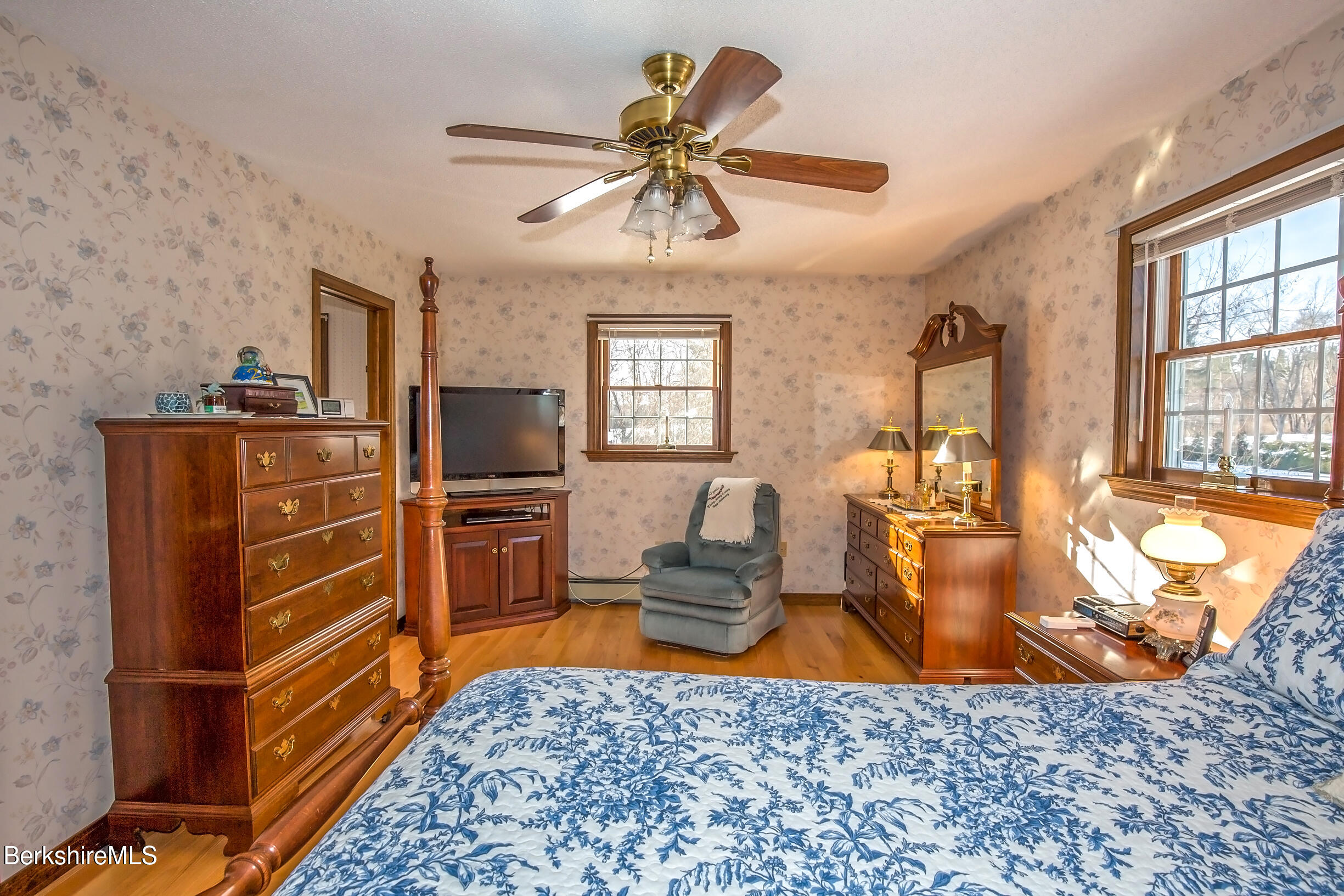 71 King William Road Lenox, MA 01240 - Photo 20 of 43 a living room with furniture a flat screen tv and kitchen view