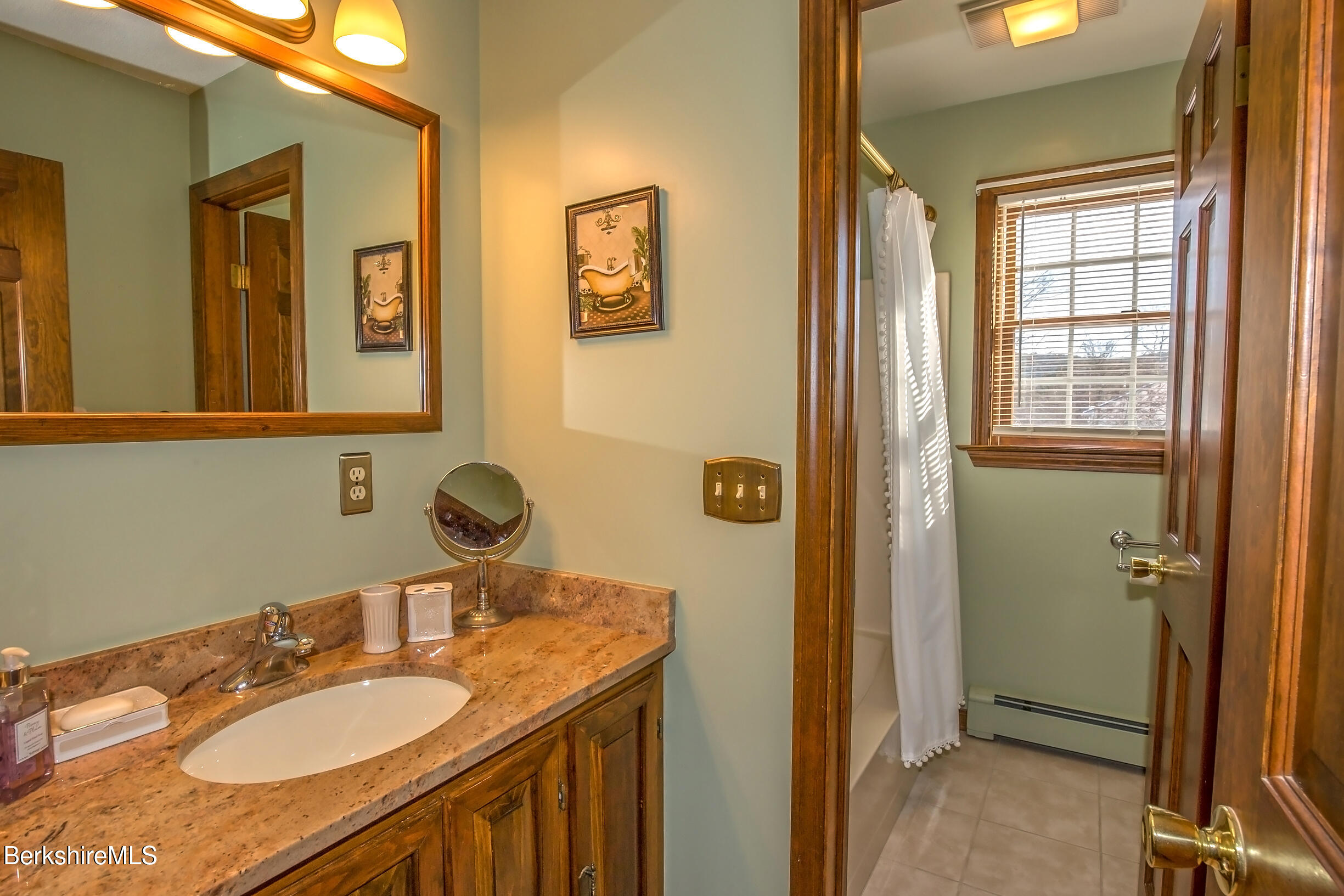 71 King William Road Lenox, MA 01240 - Photo 29 of 43 a bathroom with a granite countertop sink and a mirror