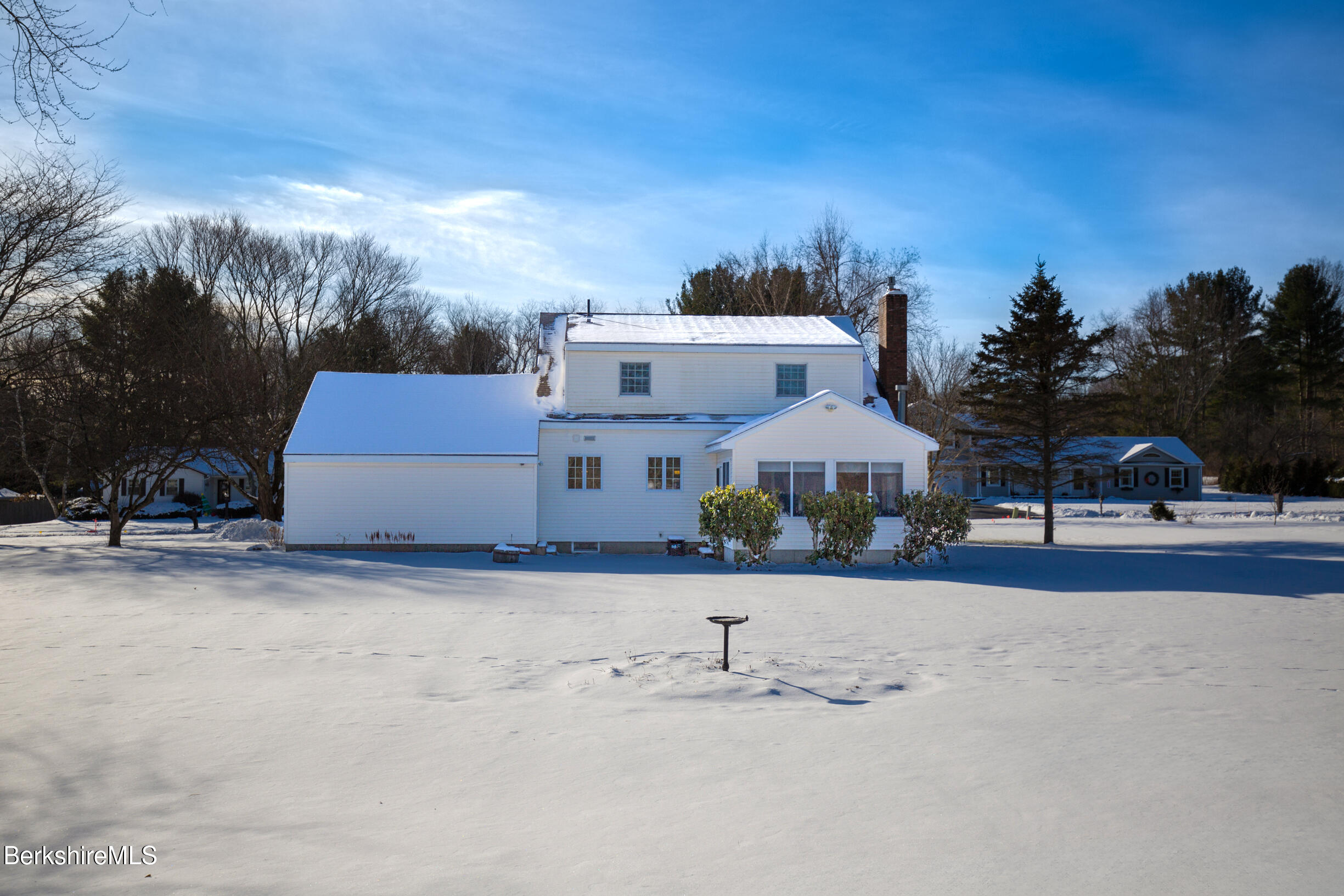 71 King William Road Lenox, MA 01240 - Photo 32 of 43 a front view of a house with a yard and a large tree