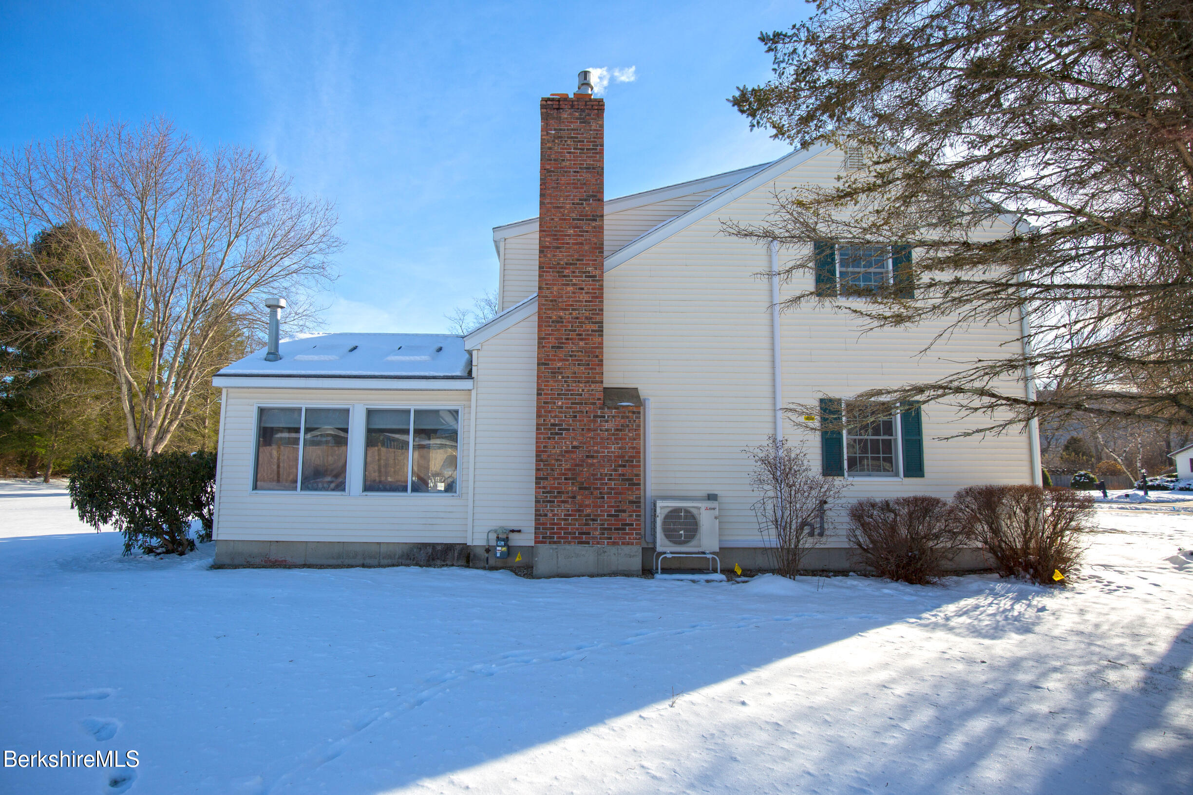 71 King William Road Lenox, MA 01240 - Photo 39 of 43 a front view of a house with a yard and garage