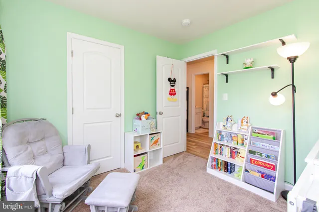 a bedroom with furniture and a shower