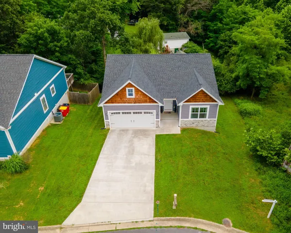 a aerial view of a house with a yard