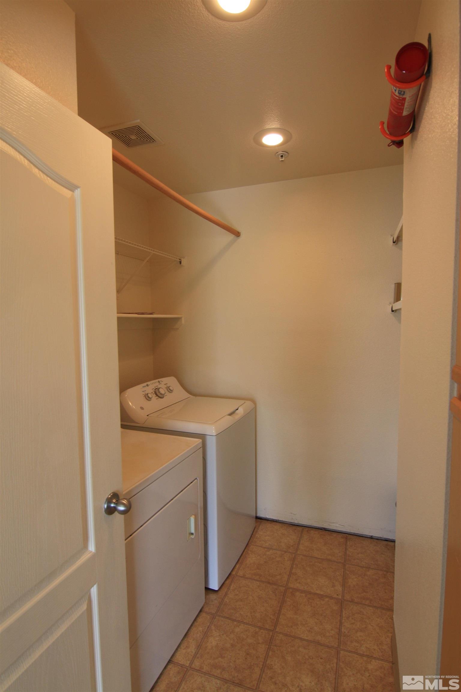 6850 Sharlands Avenue, Unit 1091 Reno, NV 89523 - Photo 9 of 11 a utility room with dryer and washer